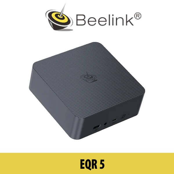 A Beelink EQR5 device showcased on a table in a modern Dubai setting, with cityscape views visible in the background.