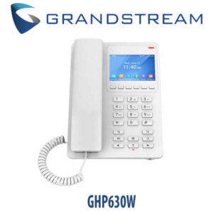 A white Grandstream GHP630W office phone with a digital screen showing the date and time, connected to a handset via a coiled cord.