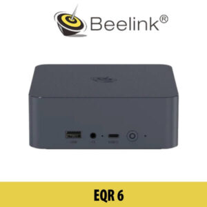 A close-up view of the compact Beelink EQR6 desktop mini PC, intricately designed with a modern aesthetic, set against the backdrop of Dubai's iconic cityscape.