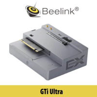 A close-up image of the Beelink GTI Ultra computer model displayed on a table with Dubai's skyline subtly visible in the background.